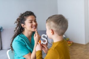 Speech scientist working with a child patient.